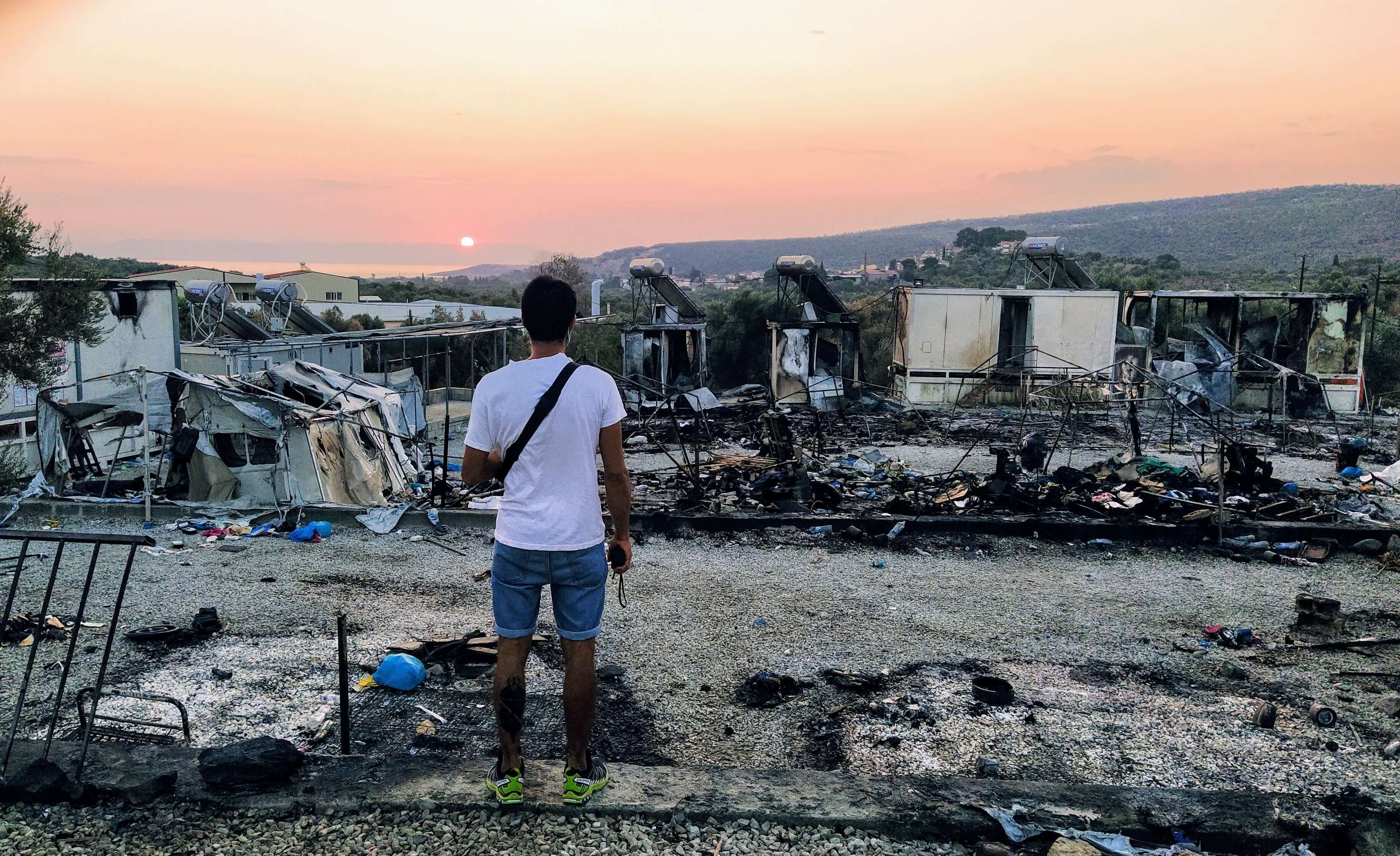 man looks over Moria, destroyed by fire
